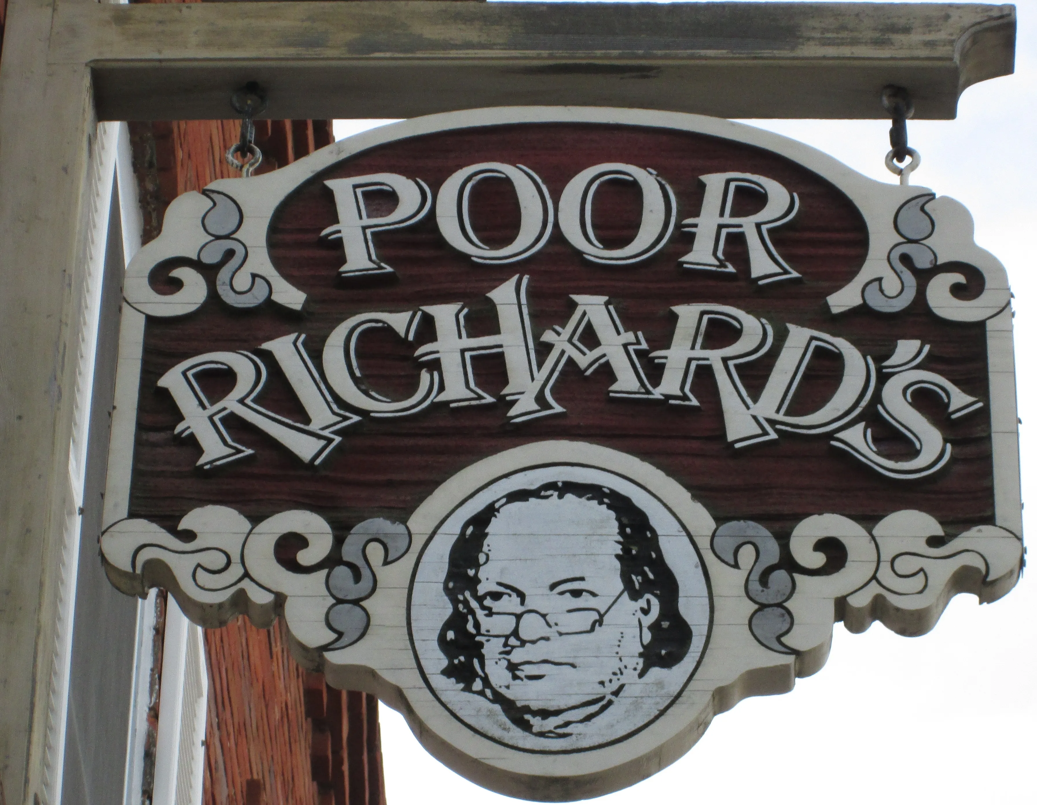 The Poor Richard's Booksellers sign on the storefront.